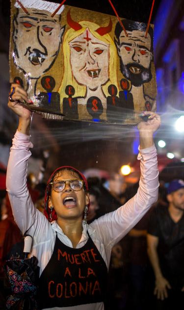 Protestors demand the resignation of Puerto Rico’s Gov. Wanda Vázquez Garced and Senate President Thomas Rivera Schatz  during new protests in front of the governor’s mansion on January 23, 2020 in San Juan, Puerto Rico. Photo by Jose Jimenez/Getty Images