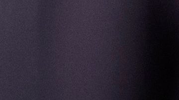 Friends sharing popcorn in theater. Getty Images