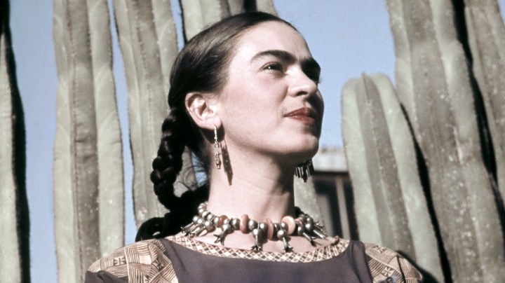 Artist Frida Kahlo poses for a portrait at the home and studio she shared with her husband Diego Rivera. Photo by Ivan Dmitri/Michael Ochs Archives/Getty Images