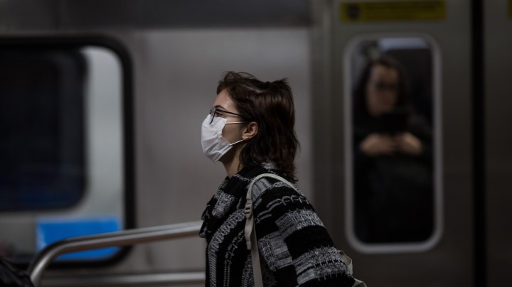 A woman wears a protective mask as walking on the subway on February 27, 2020 in São Paulo, Brazil. Photo by Victor Moriyama/Getty Images