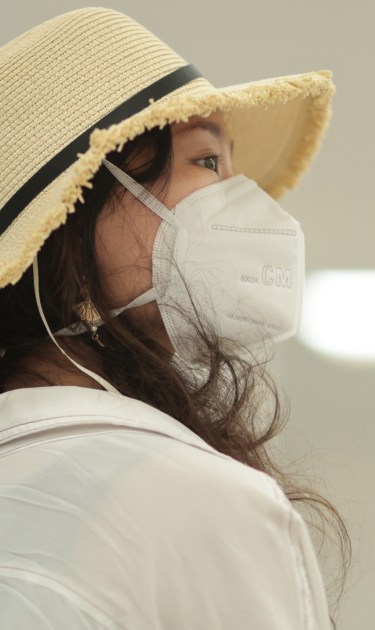 A passenger wearing a protective masks looks on after arriving at Mexico City airport on March 13, 2020 in Mexico City, Mexico. Photo by Hector Vivas/Getty Images
