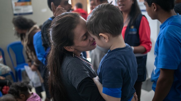 Raina Lisette embraces her son Lester Andre, 4, after the two arrived on an ICE deportation flight from Brownsville Texas on August 29, 2019 to Guatemala City. Photo by John Moore/Getty Images