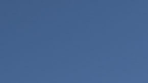 A demonstrator looks on next to a fountain dyed with red ink during a rally on International Women's Day on March 8, 2020 in Mexico City, Mexico. Photo by Toya Sarno Jordan/Getty Images