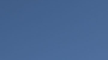 A demonstrator looks on next to a fountain dyed with red ink during a rally on International Women's Day on March 8, 2020 in Mexico City, Mexico. Photo by Toya Sarno Jordan/Getty Images