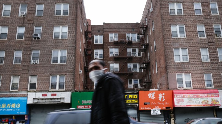 walk through a neighborhood in the Queens borough, which has one of the highest infection rates of coronavirus in the nation, on April 03, 2020 in New York City. Photo by Spencer Platt/Getty Images