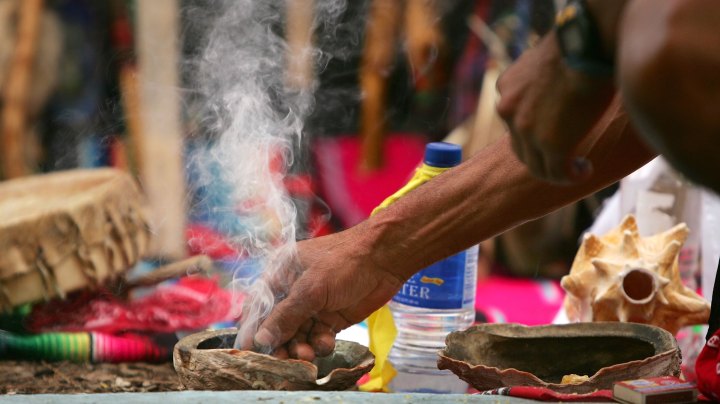 Smoke rises from an abalone shell containing burning copal that is traditionally used in Native American cleansing ceremonies and now is used by day laborers who continue their 3,000-mile, two-month run from Santa Monica, California to New York City to raise awareness of discrimination faced by immigrant day laborers and reportedly to call for citizenship for undocumented immigrants on March 6, 2006 in Pomona, California. Photo by David McNew/Getty Images