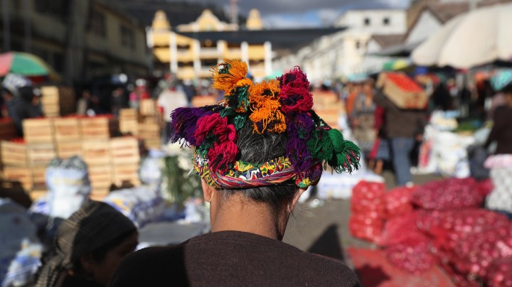 A woman, wearing traditional Mayan dress, shops at a vegetable market on February 11, 2017 in Almolonga, Guatemala. Photo by John Moore/Getty Images