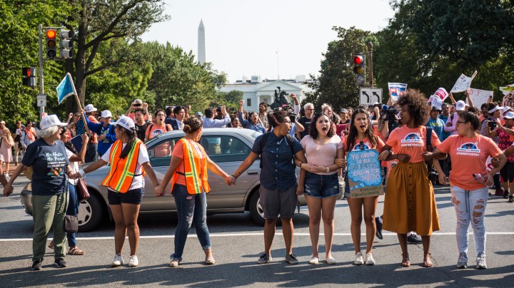 Demonstrators block traffic on H Street during a rally in support of the Deferred Action for Childhood Arrivals (DACA) program after the Trump Administration announced its plan to end the program on September 5, 2017 in Washington, DC. Photo by Zach Gibson/Getty Images