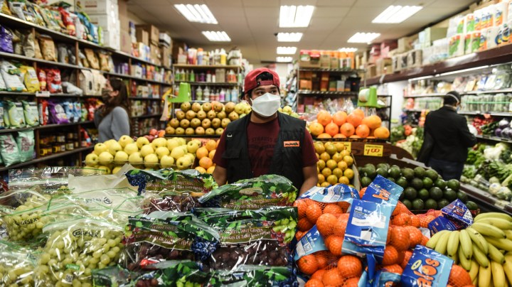 A bodega worker restocks produce on April 28, 2020 in the Brooklyn borough in New York City. Photo by Stephanie Keith/Getty Images