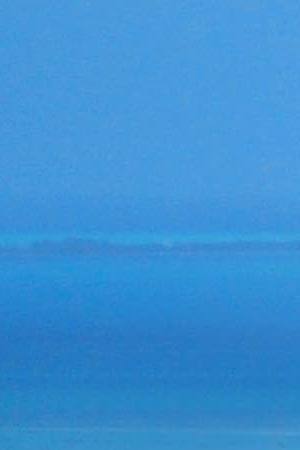 Flying into Belize City, Belize with Caribbean view in the background. Getty Images