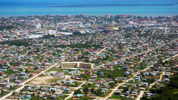 Flying into Belize City, Belize with Caribbean view in the background. Getty Images