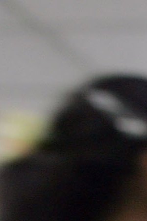 Marielys Krystel Dominguez Guerra from Panama looks through a microscope during a class while attending the Latin American School of Medical Sciences December 4, 2006 in Havana, Cuba. Photo by Joe Raedle/Getty Images