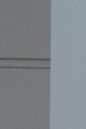 A man and woman sit on a bench in front of 'Untitled' by Jean-Michel Basquiat (estimated at ¬£7.5 million to ¬£10 million) during a preview of the Contemporary Art sale at Sotheby's on June 14, 2018 in London, England. Photo by Chris J Ratcliffe/Getty Images