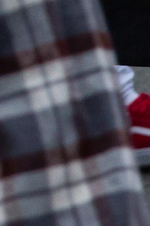 A U.S. flag burns outside of Bellevue Square Mall while looting takes place on May 31, 2020 in Bellevue, Washington. Protests due to the recent death of George Floyd took place in Bellevue in addition to Seattle, with looting in Bellevue and at least one burned automobile there. Photo by David Ryder/Getty Images