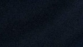 A woman places flowers down at a memorial site for George Floyd on June 10, 2020 in Minneapolis, Minnesota. Photo by Brandon Bell/Getty Images