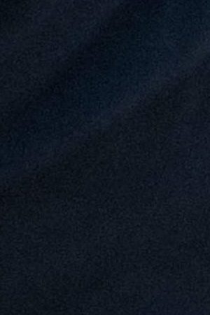 A woman places flowers down at a memorial site for George Floyd on June 10, 2020 in Minneapolis, Minnesota. Photo by Brandon Bell/Getty Images