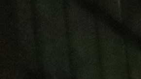 A demonstrator walks in front of a line of police officers during a protest sparked by the death of George Floyd while in police custody on May 29, 2020 in Oakland, California. Photo by Justin Sullivan/Getty Images