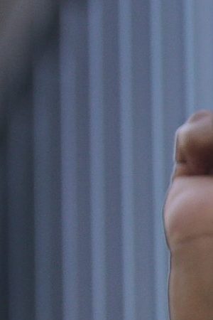 A football fan demonstrator holds a sign that reads "Our brother, George Floyd" as clashing with riot police during a protest against President of Brazil Jair Bolsonaro amidst the coronavirus pandemic at Paulista Avenue on May 31, 2020 in Sao Paulo, Brazil. Photo by Miguel Schincariol/Getty Images