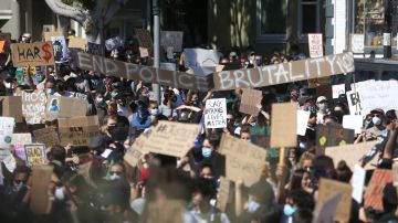 Protesters hold signs during a demonstration to honor of George Floyd on June 03, 2020 in San Francisco, California. Photo by Justin Sullivan/Getty Images
