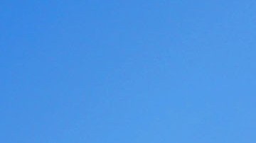 A teen (TOP) marches on stilts during a student Christmas parade on December 21, 2017 in Loiza, Puerto Rico. Photo by Mario Tama/Getty Images