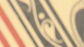 Artist Tony Peralta poses for a portrait in front of Shepard Fairey's artwork at The Dean Collection X BACARDI No Commission Art Fair.  Photo by Monica Schipper/Getty Images for Bacardi