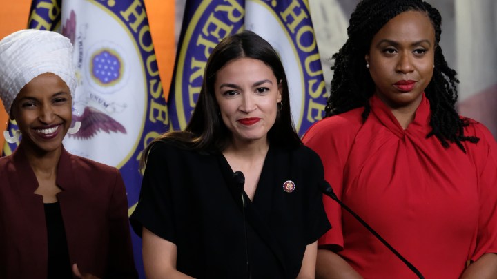 U.S. Rep. Alexandria Ocasio-Cortez (D-NY) pauses while speaking as Reps. Ilhan Omar (D-MN) and Ayanna Pressley (D-MA) listen during a news conference at the U.S. Capitol on July 15, 2019 in Washington, DC. Photo by Alex Wroblewski/Getty Images