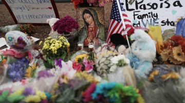 Flowers and mementos are seen at a makeshift memorial outside Walmart, near the scene of a mass shooting which left at least 20 people dead, on August 4, 2019 in El Paso, Texas. Photo by Mario Tama/Getty Images
