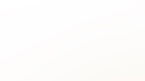 Cropped hand wearing a nitrile glove holding a COVID-19 vaccine vial and a syringe. Getty Images