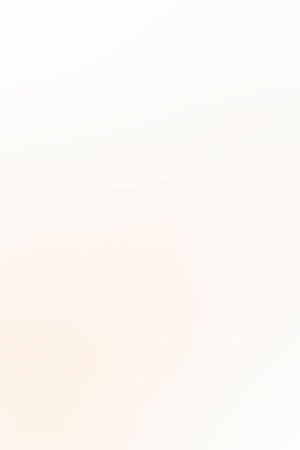 Cropped hand wearing a nitrile glove holding a COVID-19 vaccine vial and a syringe. Getty Images