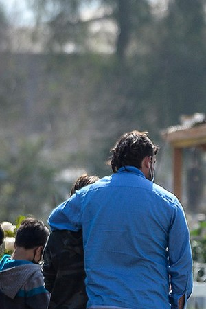 Family members of a person who died of COVID-19 attend a funeral at Cementerio General on September 4, 2020 in Santiago, Chile. Photo by Claudio Santana/Getty Images