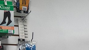 A man laughs as he watches the first presidential debate in a store on U Street on September 29, 2020 in Washington, United States. Photo by Sarah Silbiger/Getty Images