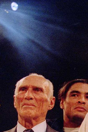 Jiu-Jitsu black belt Royce Gracie (USA) receives a $50,000 check after becoming "The Ultimate Fighter" by defeating Gerard Gordeau of the Netherlands int he finals of the Ultimate Fighter Championships in Denver, Colorado. Photo by Markus Boesch