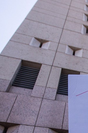 People demonstrate and call out words of encouragement to detainees held inside the Metropolitan Detention Center after marching to decry Trump administration immigration and refugee policies on June 30, 2018 in Los Angeles, California. Photo by David McNew/Getty Images.