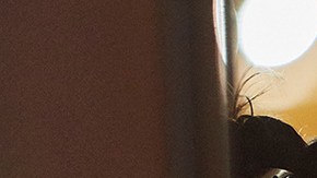 A woman wearing a mask eyes her smartphone as she waits for a tram on October 14, 2020 in Amsterdam, Netherlands. Photo by Pierre Crom/Getty Images