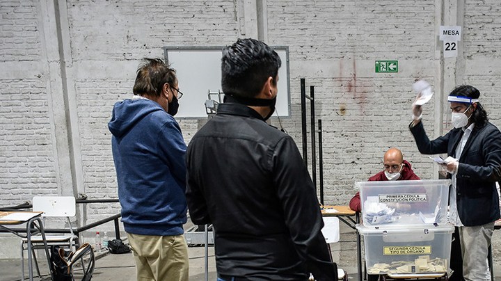 Electoral officers count the ballots at Amunategui High School during Constitutional Referendum on October 25, 2020 in Santiago, Chile. Photo by Claudio Santana/Getty Images