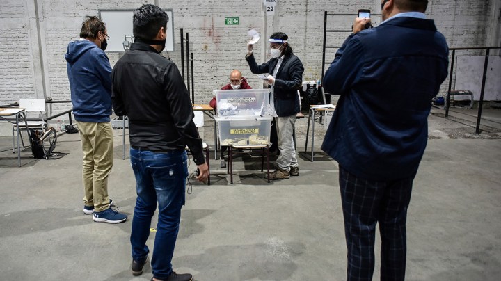 Electoral officers count the ballots at Amunategui High School during Constitutional Referendum on October 25, 2020 in Santiago, Chile. Photo by Claudio Santana/Getty Images