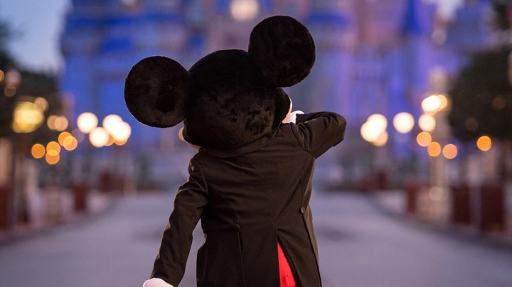 Mickey Mouse walks down Main Street, U.S.A. just before sunrise at Walt Disney World Resort on July 11, 2020 in Lake Buena Vista, Florida. Photo by Kent Phillips/Walt Disney World Resort via Getty Images