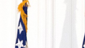 President Donald Trump removes his mask upon return to the White House from Walter Reed National Military Medical Center on October 05, 2020 in Washington, DC. Photo by Win McNamee/Getty Images.