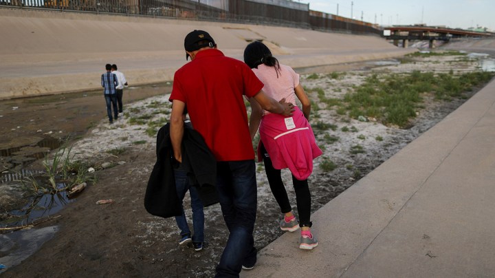 Migrants walk on their way to cross the border between the U.S. and Mexico at the Rio Grande river, as they prepare to enter El Paso, Texas, on May 19, 2019 as taken from Ciudad Juarez, Mexico. Photo by Mario Tama/Getty Images