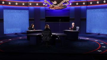 Democratic vice presidential nominee Sen. Kamala Harris (D-CA) and U.S. Vice President Mike Pence participate in the vice presidential debate moderated by Washington Bureau Chief for USA Today Susan Page (C) at the University of Utah on October 7, 2020 in Salt Lake City, Utah. Photo by Alex Wong/Getty Images