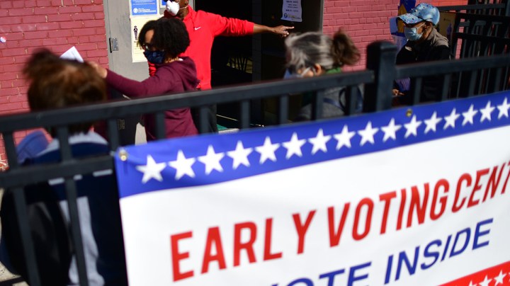 Long lines of voters wait to cast early voting ballots at the A. B. Day School polling location on October 17, 2020 in Philadelphia, Pennsylvania. Photo by Mark Makela/Getty Images