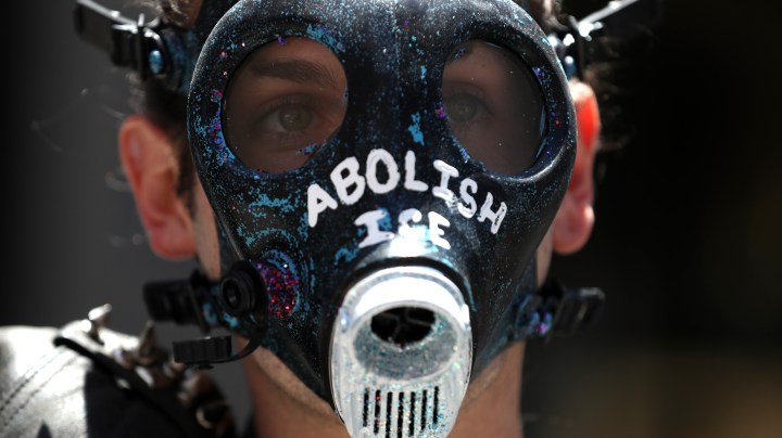 SAN FRANCISCO, CALIFORNIA - JULY 02: A protester wears a gas mask with "abolish ICE" written on it during a demonstration against migrant detention facilities on July 02, 2019 in San Francisco, California. Hundreds of protesters rallied against migrant detention centers in San Francisco and cities across the United States. (Photo by Justin Sullivan/Getty Images)