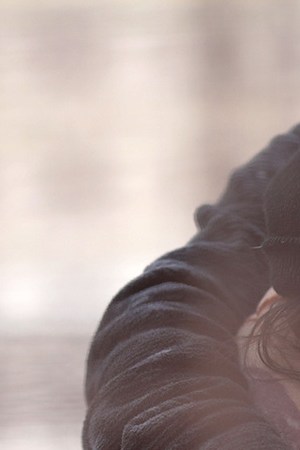 Central American immigrants wait to be taken into custody at the U.S.-Mexico border fence after crossing the Rio Grande from Mexico on February 01, 2019 in El Paso, Texas. Photo by John Moore/Getty Images