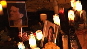 U.S. born children of Mexican immigrants gaze at a makeshift shrine at the University Medical Center, for those killed and wounded during an attack on U.S. Rep. Gabrielle Giffords (D-AZ) on January 9, 2011 in Tucson, Arizona. Photo by John Moore/Getty Images