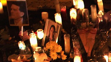 U.S. born children of Mexican immigrants gaze at a makeshift shrine at the University Medical Center, for those killed and wounded during an attack on U.S. Rep. Gabrielle Giffords (D-AZ) on January 9, 2011 in Tucson, Arizona. Photo by John Moore/Getty Images