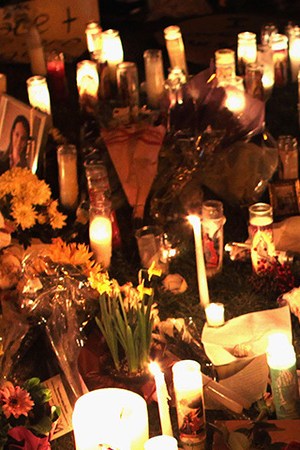 U.S. born children of Mexican immigrants gaze at a makeshift shrine at the University Medical Center, for those killed and wounded during an attack on U.S. Rep. Gabrielle Giffords (D-AZ) on January 9, 2011 in Tucson, Arizona. Photo by John Moore/Getty Images
