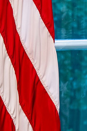 A sculpted bust of Cesar Chavez oversees a collection of personal framed photos on a table seen during an early preview of the redesigned Oval Office awaiting President Joseph Biden at the White House in Washington, DC. (Photo by Bill O'Leary/The Washington Post via Getty Images)