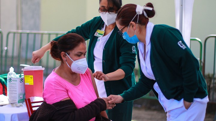 A medical worker receives the Pfizer/BioNTech vaccine as part of Mexico COVID-19 vaccination plan at 81st Infantry Batallion facilities on December 28, 2020 in Mexico City, Mexico. (Photo by Manuel Velasquez/Getty Images)