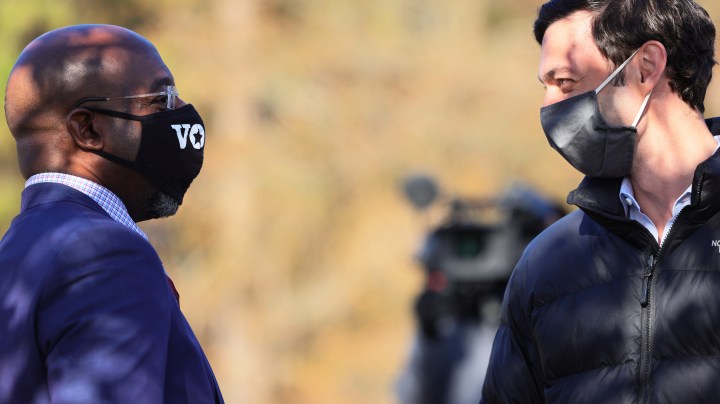 HEPHZIBAH, GEORGIA - JANUARY 04: Georgia Democratic Senate candidates Rev. Raphael Warnock and Jon Ossoff speak before an Augusta canvass launch block party at Robert Howard Community Center on January 04, 2021 in Hephzibah, Georgia. On the final day before the January 5th runoff election, Warnock and Ossoff, who are challenging Republican incumbent senators Kelly Loeffler and David Perdue, respectively, made their last pitches to voters at a block party and canvass launch. (Photo by Michael M. Santiago/Getty Images)