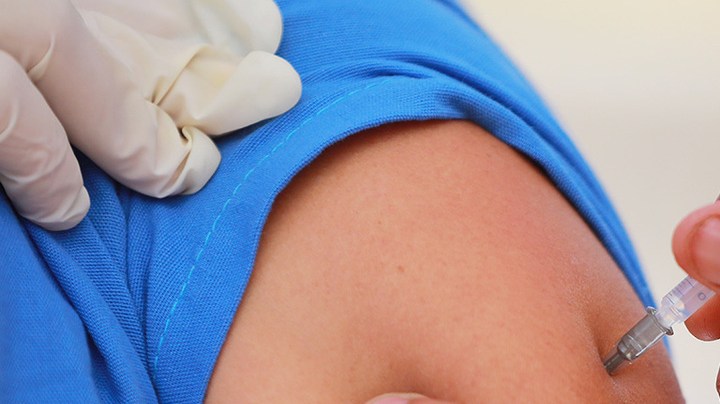 A medical worker receives the Pfizer/BioNTech vaccine as part of Mexico COVID-19 vaccination plan at 81st Infantry Batallion facilities on December 28, 2020 in Mexico City, Mexico. Photo by Manuel Velasquez/Getty Images